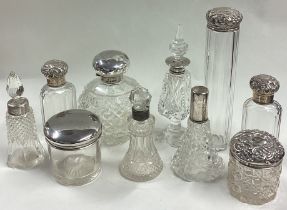 A large box containing silver hobnail cut glass scent bottles.