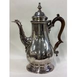 A George III silver coffee pot.