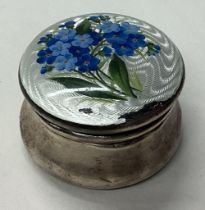 A silver and enamelled pill box with lift-off cover.