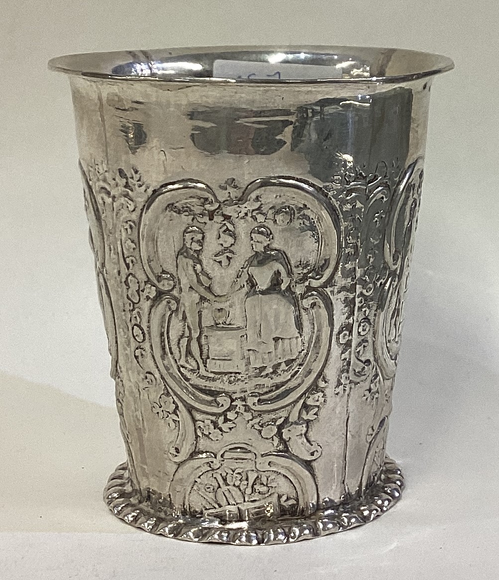 An Antique silver beaker.