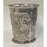 An Antique silver beaker.