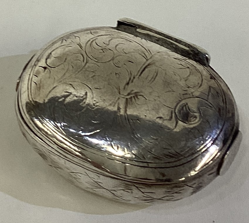 A 17th Century William and Mary silver squeeze sided snuff box.