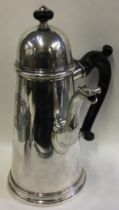 A fine silver coffee pot with crested side. London 1722.