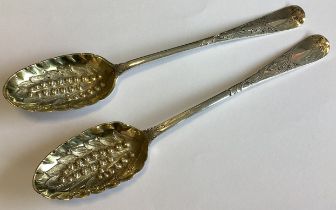 A matched pair of Georgian silver berry spoons.