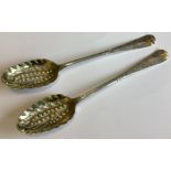 A matched pair of Georgian silver berry spoons.