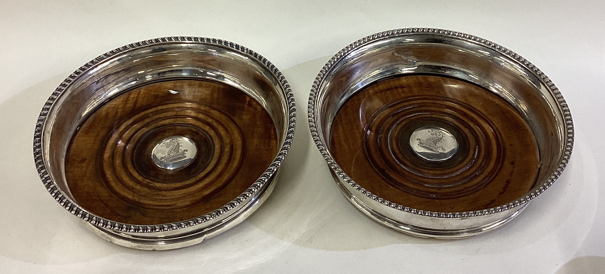 A matched pair of George III silver coasters.