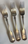 EXETER: A heavy set of three silver fiddle pattern table forks.
