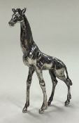 A contemporary silver figure of a giraffe.