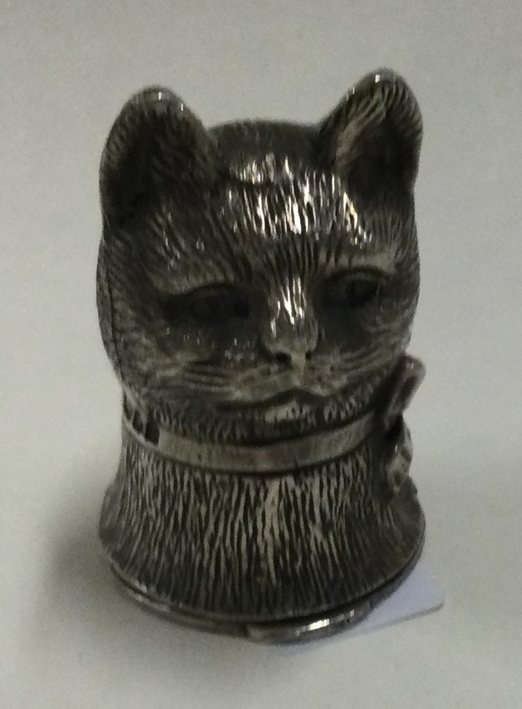 A silver vesta case in the form of a cat.