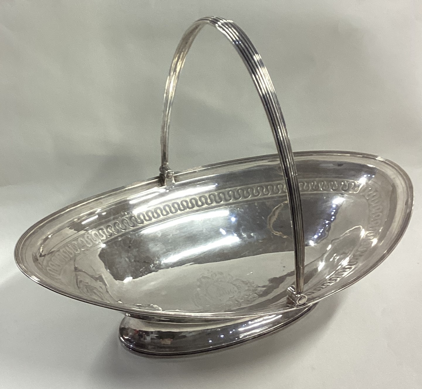 A large George III silver swing handled basket.