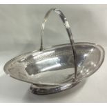 A large George III silver swing handled basket.