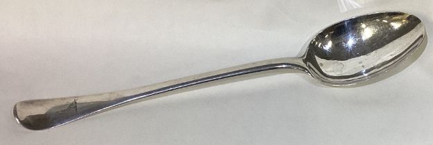 A large 18th Century Provincial silver bottom marked basting spoon.