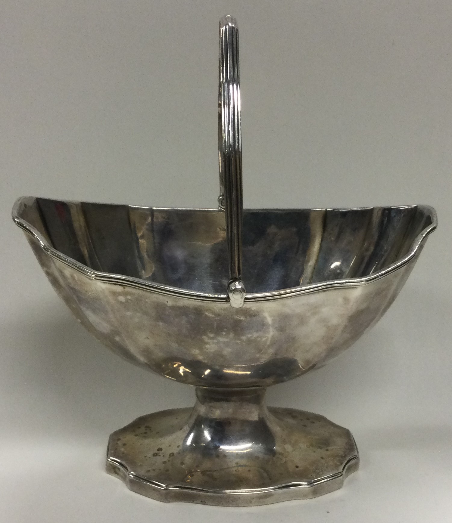 An 18th Century George III silver swing handled basket.