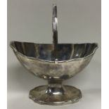 An 18th Century George III silver swing handled basket.