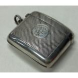 A large Victorian silver vesta case with engine turned decoration.