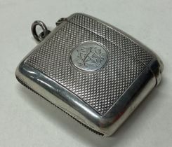 A large Victorian silver vesta case with engine turned decoration.