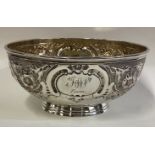 A Victorian silver bowl with chased decoration.