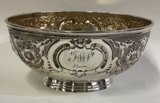 A Victorian silver bowl with chased decoration.