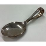 A silver caddy spoon. Birmingham 1960.