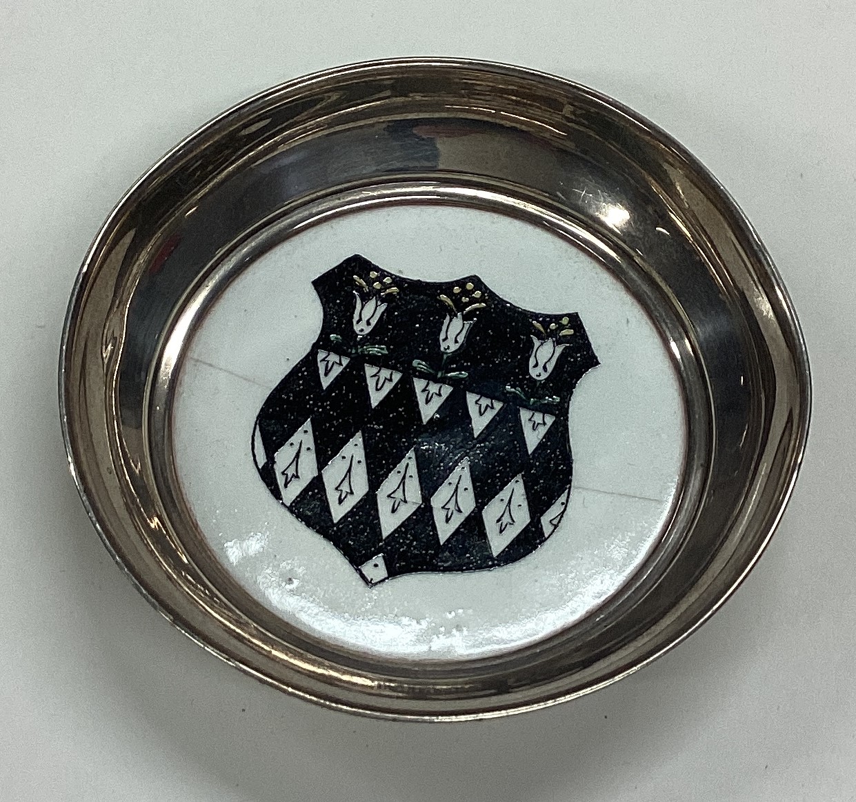 A silver mounted Carlton Ware dish with central armorial.