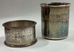 A Continental silver shot cup together with a napkin ring.
