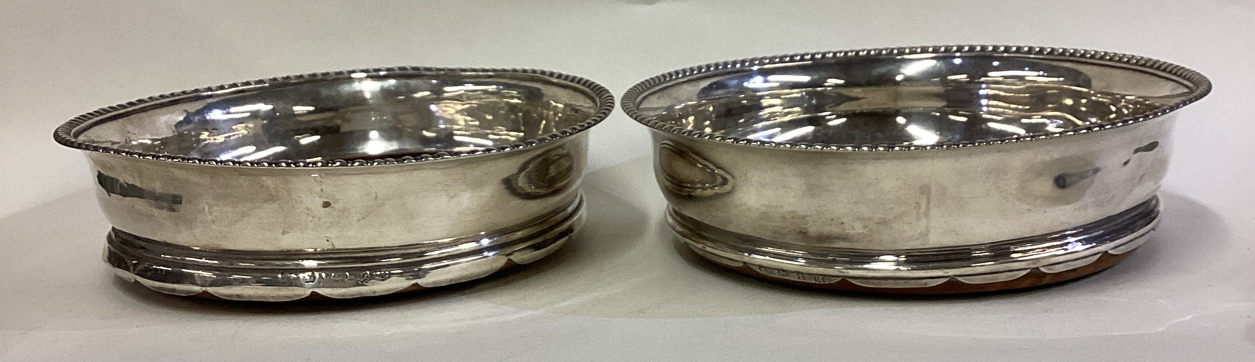 A matched pair of George III silver coasters. - Image 2 of 3