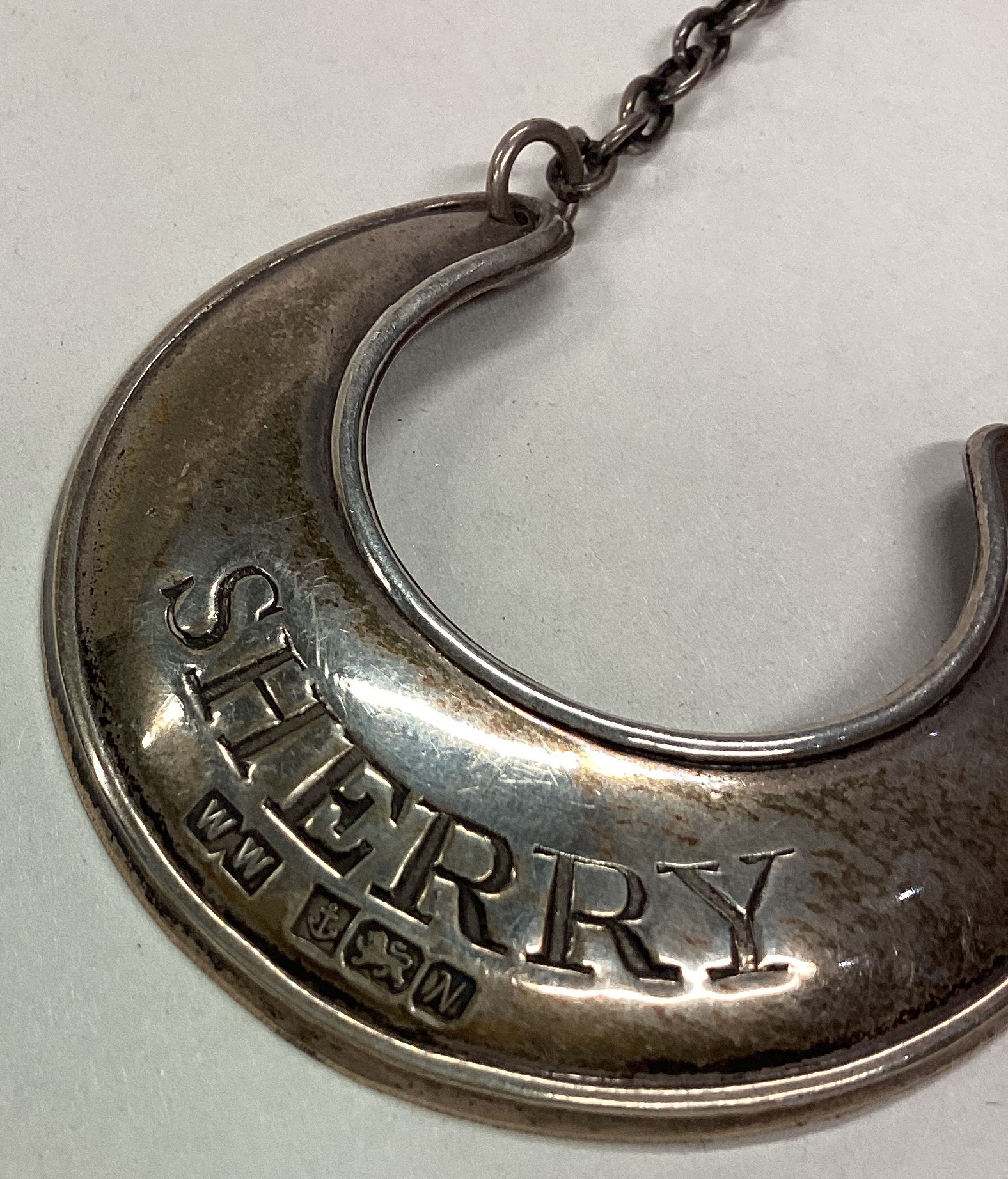 A crescent shaped silver wine label for 'Sherry'. - Image 2 of 2