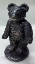 A novelty silver figure of a standing teddy bear.