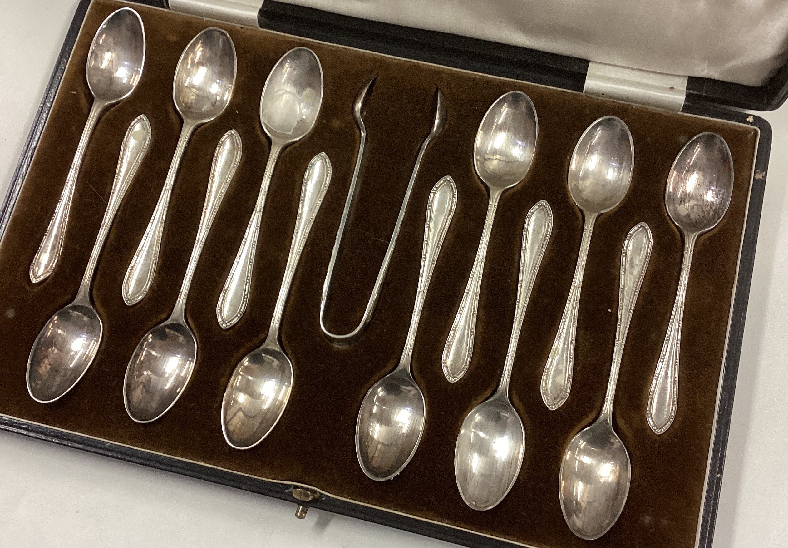 A good set of twelve silver coffee spoons together with matching tongs. - Image 2 of 3