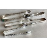 A good collection of silver sugar tongs. Various dates and makers.