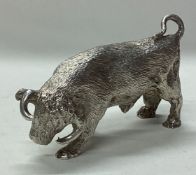 A novelty heavy silver figure of a bull.