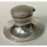 A silver inkwell.