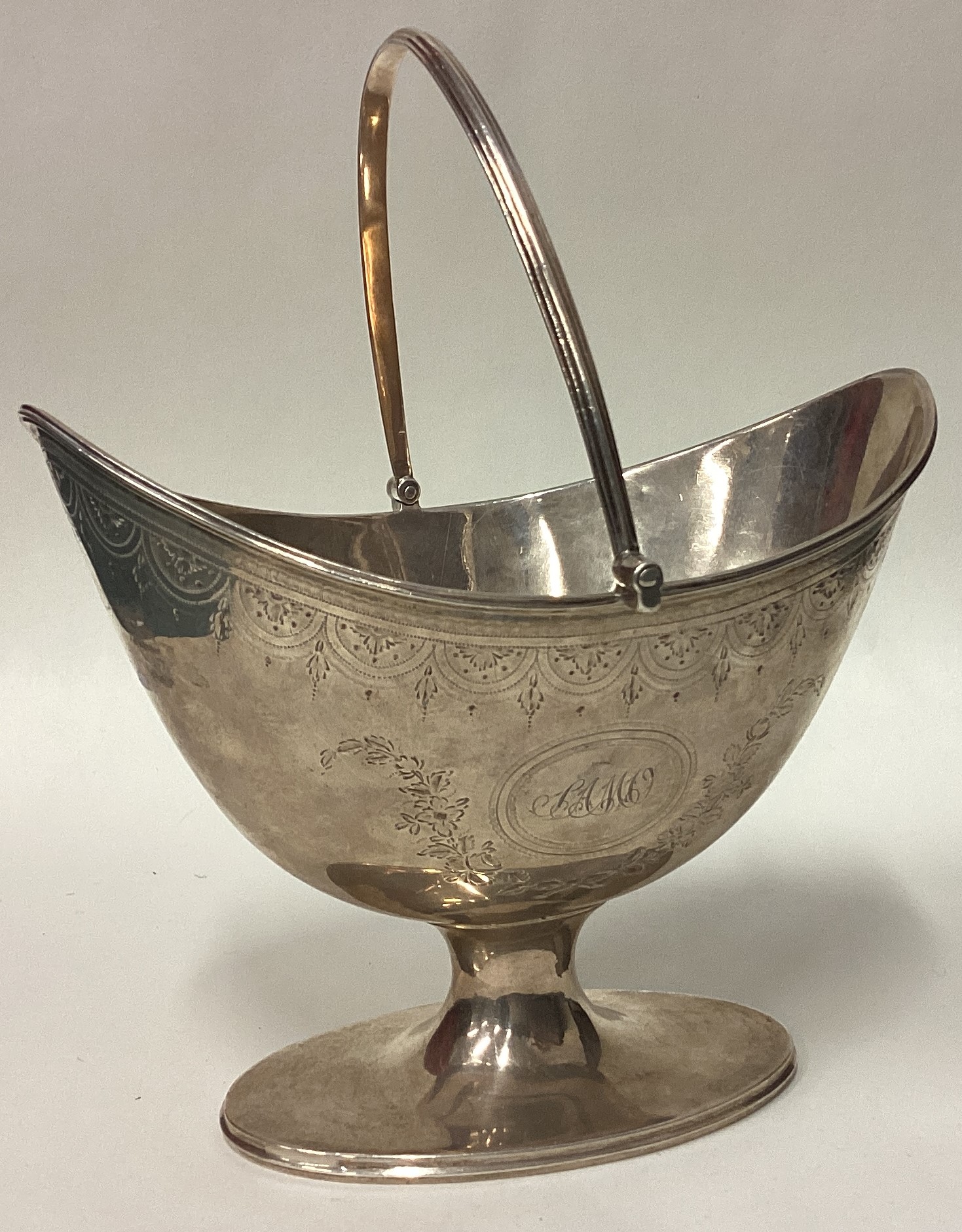 An 18th Century George III silver basket with bright-cut decoration.