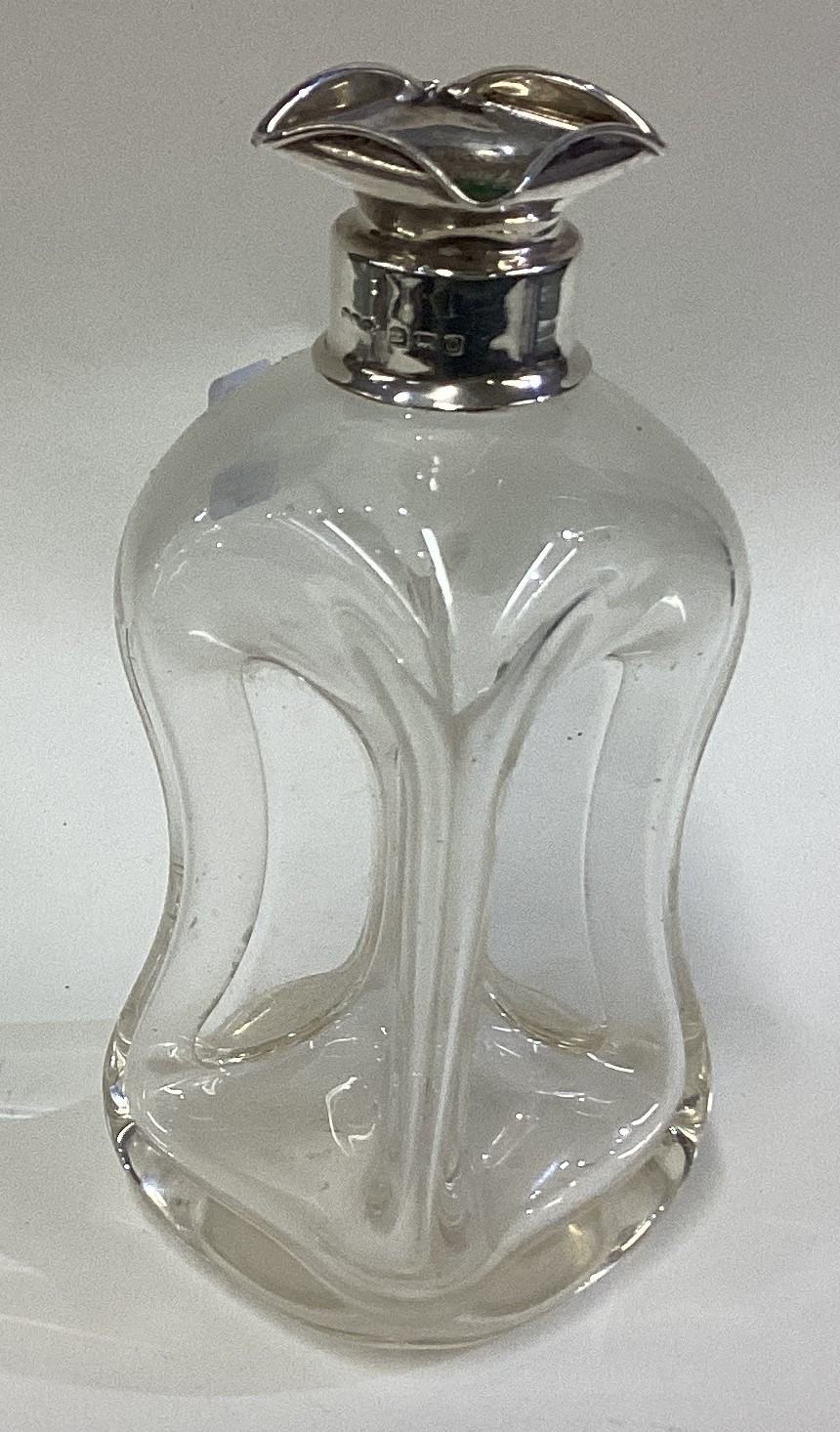 A silver mounted glug glug decanter.