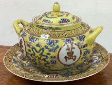 A Chinese tureen and cover in yellow ground together with a dish.