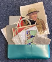 A folder containing documents and photographs of Australia and New Zealand Forces.