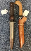 A WW2 knife together with an Eastern dagger.