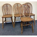 A set of four oak wheelback chairs.
