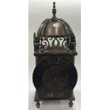 A brass mounted lantern clock. By Mappin & Webb.