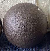 A large single cannon ball.