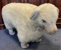 A large woolly sheep footstool nicknamed 'Nigel'. Approx. 55 cms high. Est. £20 - £30.