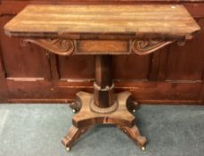 A rosewood hinged top table.