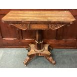 A rosewood hinged top table.