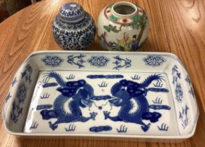 A Chinese urn together with blue and white plates etc.