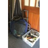 A collection of fishing reels, rods and travel bag.