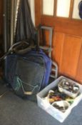 A collection of fishing reels, rods and travel bag.