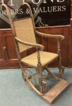 An old cane mounted wheelchair.