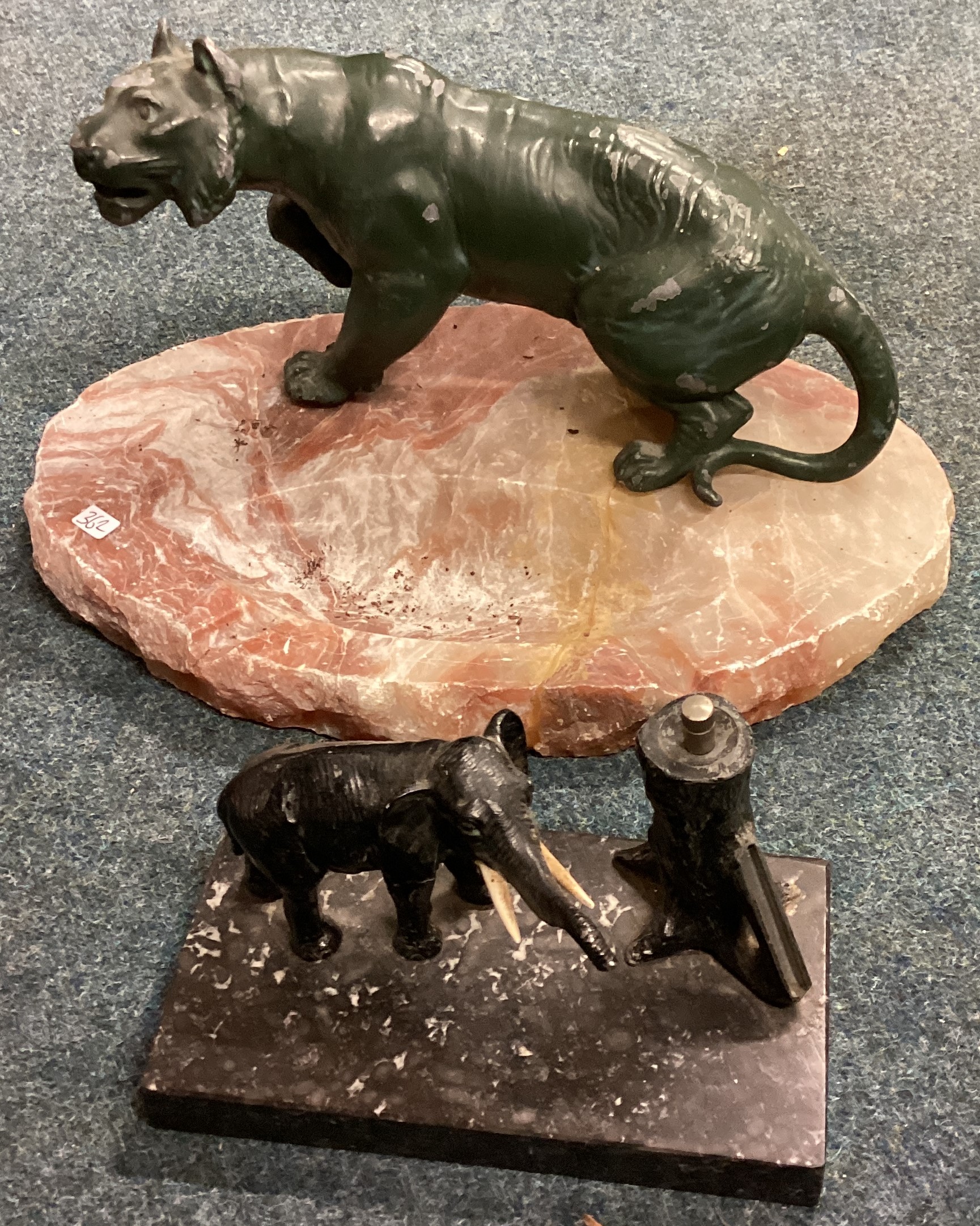 A large marble ashtray mounted with a tiger together with a sculpture of a greyhound etc.