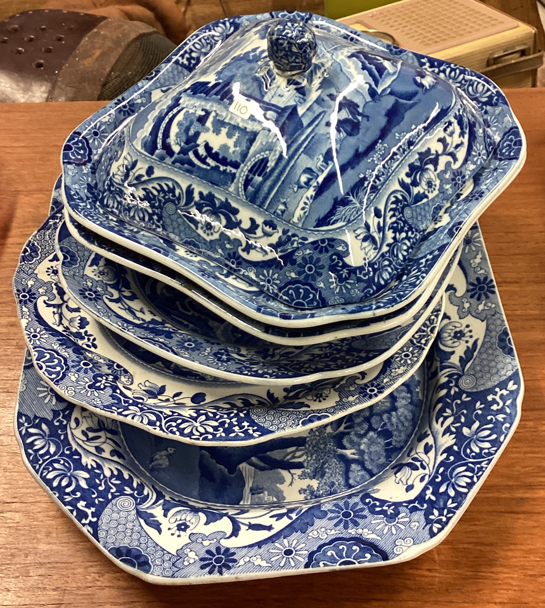 A collection of blue and white meat plates.