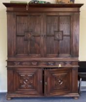 A massive mahogany four-door cupboard.